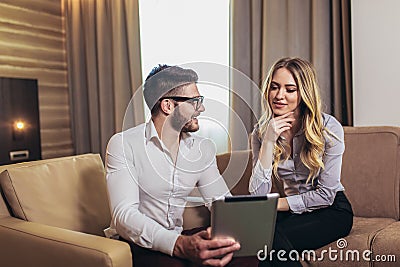 Young business colleagues working on some business ideas in hotel room Stock Photo