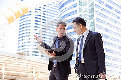 Young business guy gets unsatisfied his boss for disapprove of p Stock Photo