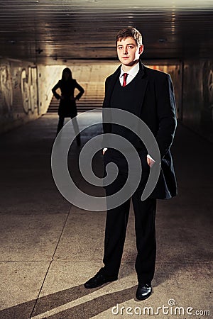 Young fashion business man in underground tunnel Stock Photo