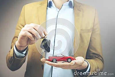 Man hand red car and key Stock Photo