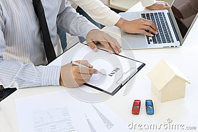 Young Business man insurance agent show document contract Stock Photo