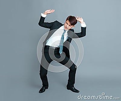 Young business man lifting something Stock Photo