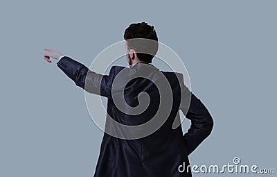 Young business man in a suit pointing with his finger Stock Photo