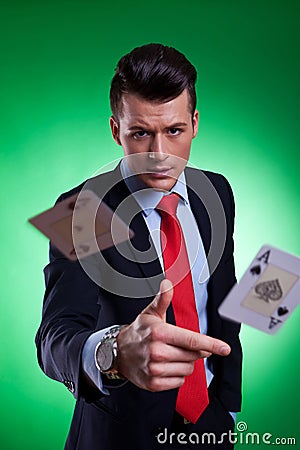 Young business man throwing the winning hand Stock Photo