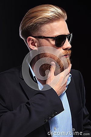 Young business man touches his beard Stock Photo