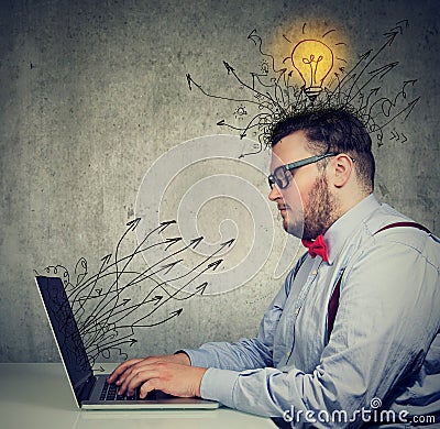 Business man working on laptop has bright ideas Stock Photo