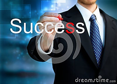 Young business man writing the word Success Stock Photo