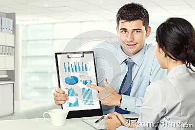 Young business partners reviewing work Stock Photo