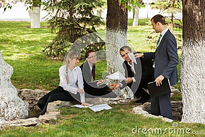 Young business people in a city park Stock Photo