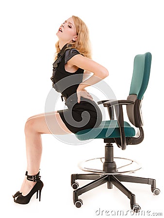 Young business woman with backache back pain. Stock Photo