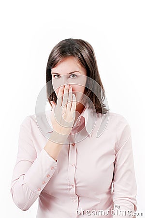 Young business woman covering with hand her mouth. Stock Photo