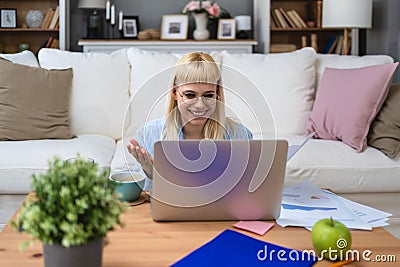 Young business woman freelance expatriate financial and digital marketing expert in smart casual working at home in home office Stock Photo