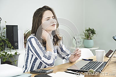 Young business woman having a neck pain. Stock Photo