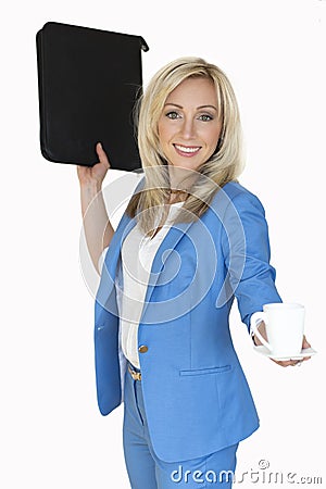 young business woman in a jacket with an office folder and a Cup of coffee, a business portrait blonde woman in a blue suit.Busin Stock Photo