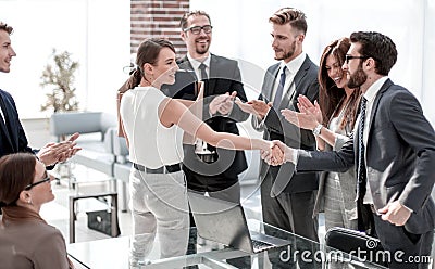 Young business woman meets colleagues in the office Stock Photo