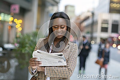 Business woman reading the headlines Stock Photo