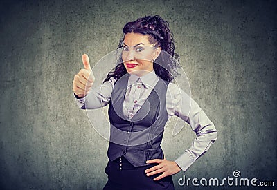 Young business woman showing thumbs up gesture Stock Photo