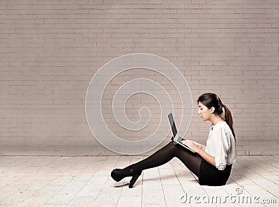 Young business woman using a laptop Stock Photo