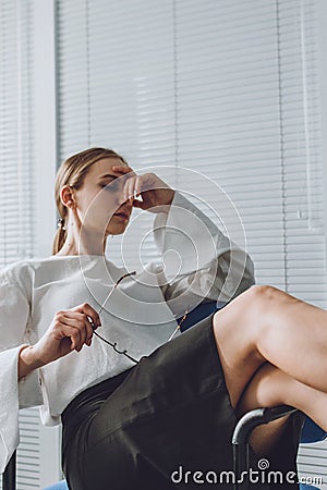 Young business woman take it easy working and resting in office. Niksen, do nothing, overwork, Life quality, living balance Stock Photo