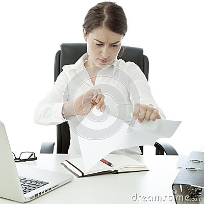 Young business woman tear paper on her desk Stock Photo