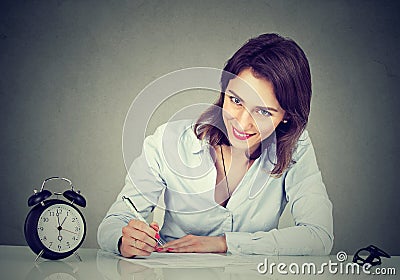 Young business woman writing a letter or filling out an application form Stock Photo
