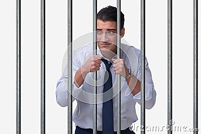 The young businessman behind the bars in prison Stock Photo