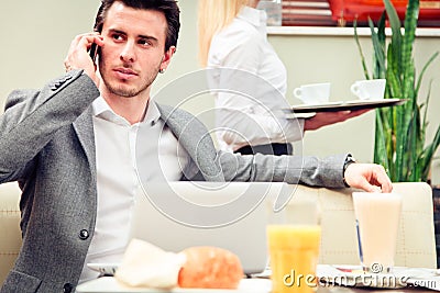 Young Businessman In A Cafe Stock Photo