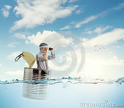 Young businessman in a can Stock Photo