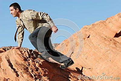 Young businessman climbing to success Stock Photo