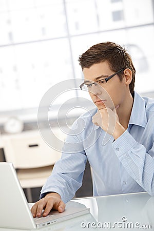 Young businessman concentrating on computer work Stock Photo