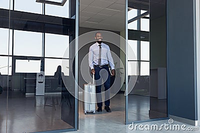 Young businessman after departure in airport, work trip, business lifestyle Stock Photo