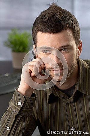 Young businessman focusing Stock Photo