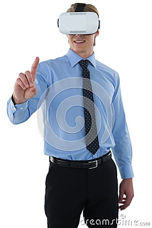 Young businessman gesturing using wearable computer Stock Photo