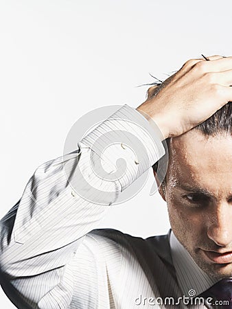 Young Businessman with Hand on Head close-up Stock Photo