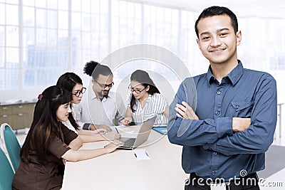 Young businessman and his team Stock Photo