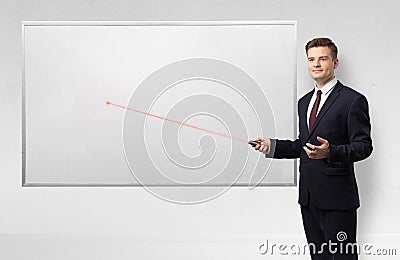 Businessman with laser pointer and copyspace white blackboard Stock Photo