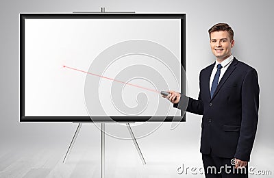 Businessman with laser pointer and copyspace white wall Stock Photo