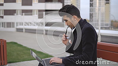 Young businessman long time working ablet computer and tired outdoor Stock Photo