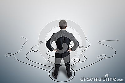 Young businessman is making decision and selecting strategy. View from behind Stock Photo