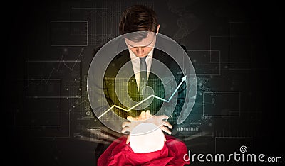 Businessman forecast the future of the stock market with a magic ball Stock Photo