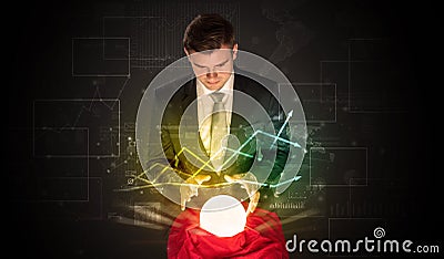 Businessman forecast the future of the stock market with a magic ball Stock Photo