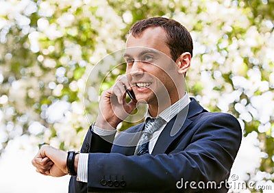Young businessman is out of office in a field Stock Photo