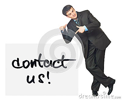 Young businessman points on a card Contact Us on a white Stock Photo