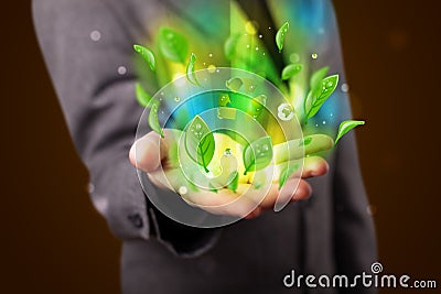 Young businessman presenting eco green leaf recycle energy concept Stock Photo