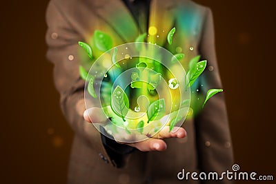 Young businessman presenting eco green leaf recycle energy concept Stock Photo