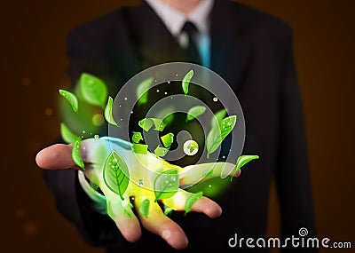 Young businessman presenting eco green leaf recycle energy concept Stock Photo