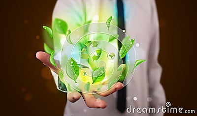 Young businessman presenting eco green leaf recycle energy concept Stock Photo