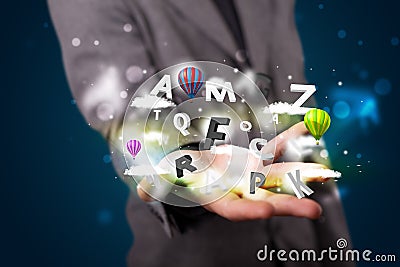 Young businessman presenting magical clouds with letters and balloons concept Stock Photo