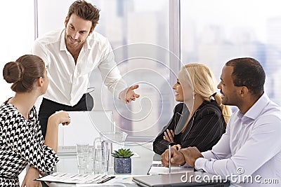 Young businessman presenting to partners Stock Photo