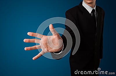 Businessman pressing imaginary button Stock Photo